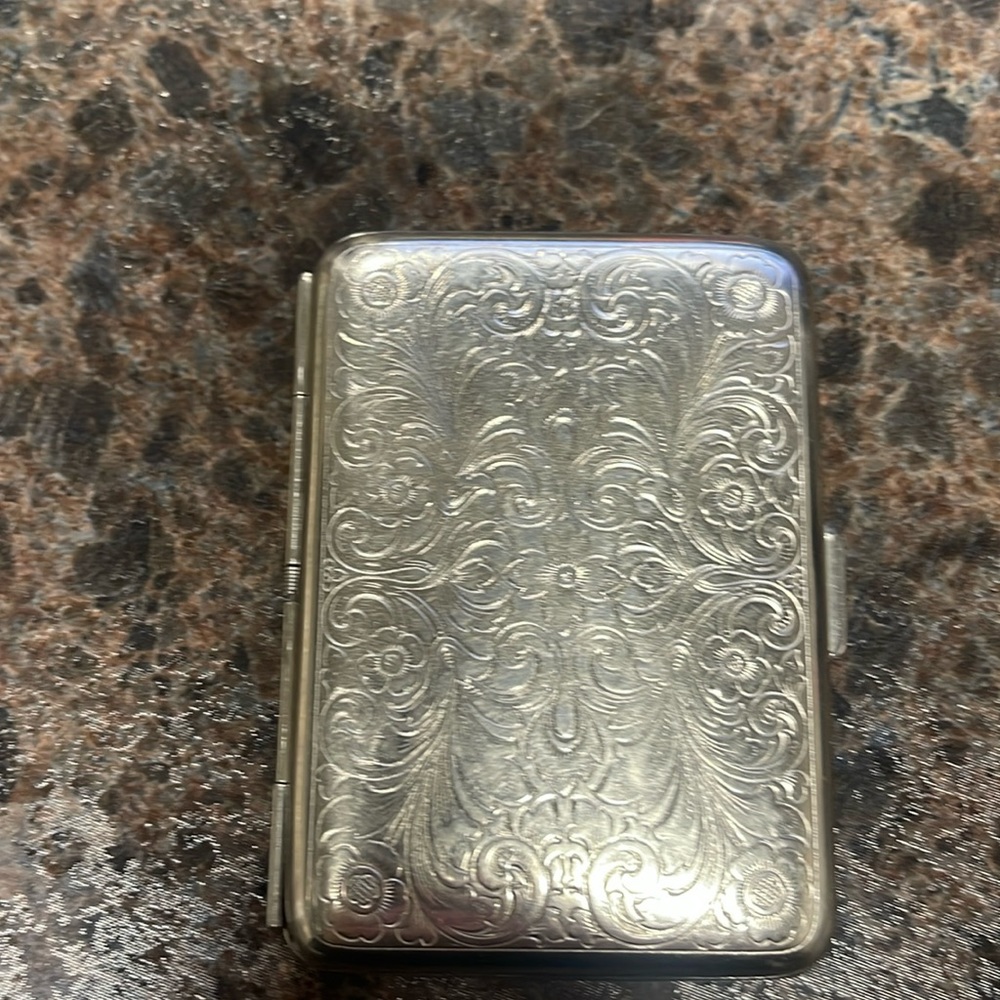 Western Sterling Silver wallet. Or old school cigarette case.